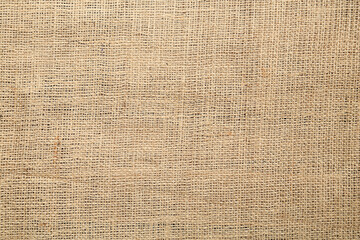 Naklejka na ściany i meble Texture of natural burlap fabric as background, top view