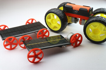 Small Solar powered vehicles with different sets of wheels along with electric car having big size...