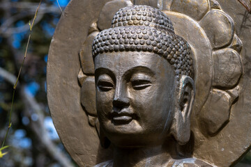 Head of Budha statue from close, outdoors