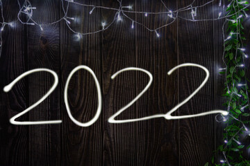 2022 wooden background with lights
