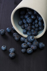 Close up of a blueberries on a wood table.