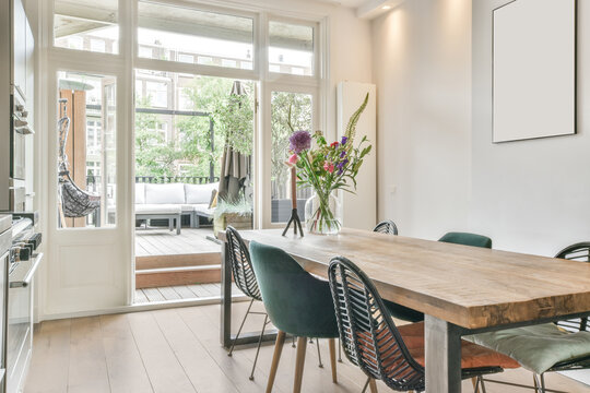Table with flowers in kitchen
