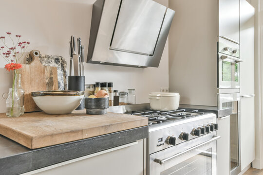 Cooker with pan near kitchen counter
