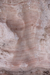 Wavy marble surface. Pink and gray colors. Vertical image. 