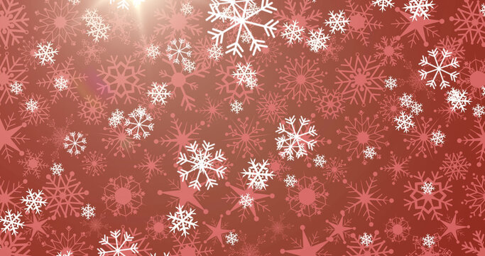 Image of snow falling on red background at christmas