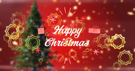 Fototapeta na wymiar Image of happy christmas text in white, with gold stars over christmas tree on red background
