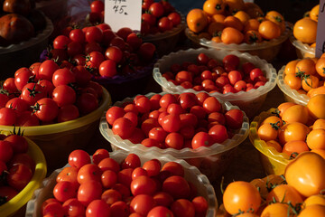 Market counter with different varieties of tomatoes, fresh and healty food, health care