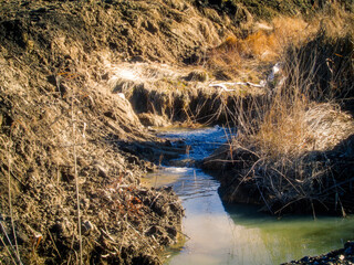 Rise of groundwater at a construction site. Powerful stream. IRTYSH river