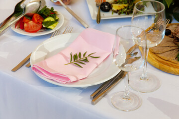 Table setting for an event party or wedding in the restaurant decorated 