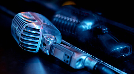 Fototapeta na wymiar Microphone on the stage in the bar of the cafe restaurant with red colorful lighting