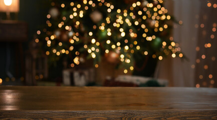 Christmas background. Empty wooden table on the background of the Christmas tree and New Year's...