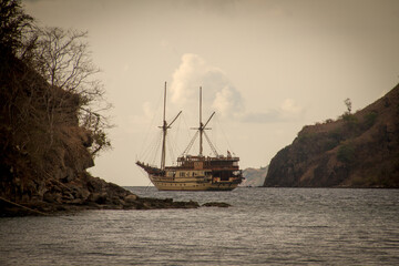 A phinisi boat departs from the port of Labuan Bajo, carrying tourists who will visit the islands...