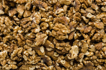 Brown walnuts background. Closeup. Healthy snack. Top down view.
