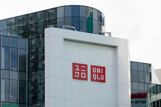 Toronto, Canada - November 16, 2021: Uniqlo store sign on the wall at Eaton Centre in Toronto, Canada. Uniqlo Co., Ltd. is a Japanese casual wear designer, manufacturer and retailer.