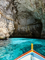 View on the Blue Grotto caves from a boat in Malta.