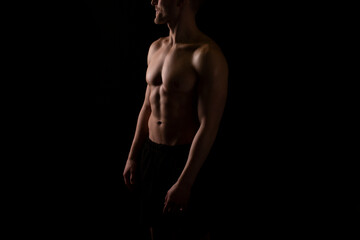 Man Showing ABS. Muscle man Posing. Strong Body Concept. Topless Sport man Bodybuilder. Six Pack Spotsman