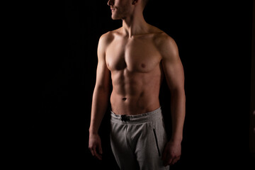 Obraz na płótnie Canvas Man Showing ABS. Muscle man Posing. Strong Body Concept. Topless Sport man Bodybuilder. Six Pack Spotsman