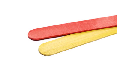 Red yellow wooden spatulas, plywood planks, boards isolated on white  