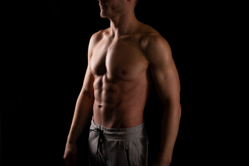 Fototapeta na wymiar Man Showing ABS. Muscle man Posing. Strong Body Concept. Topless Sport man Bodybuilder. Six Pack Spotsman