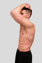 Fototapeta premium Man Showing ABS. Muscle man Posing. Strong Body Concept. Topless Sport man Bodybuilder. Six Pack Spotsman