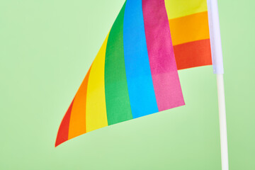 Rainbow flag of LGBT community, lesbian gay bisexual transgender and queer pride on green background