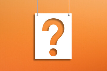 Question mark on paper hanging with rope on orange background