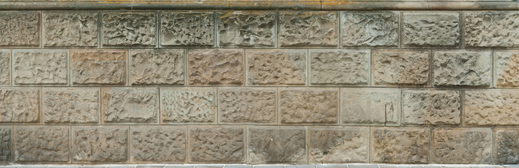 Texture of brick wall and concrete blocks. Samples of stone plates stacked evenly in a row.
