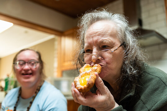 Hakendover, Flemish Brabant, Belgium - 09 20 2021: Disabled 39 Year Old Woman And Her 83 Year Old Mother Having Fun In The Kitchen At Home