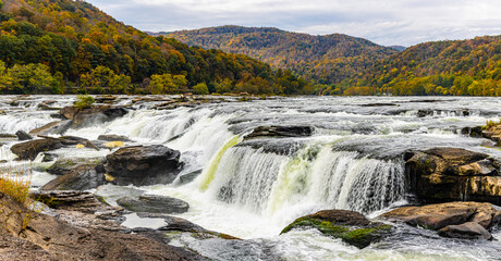 Fototapeta na wymiar Sandstone Falls With Fall Color, New River Gorge National Park, West Virginia, USA