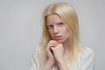 Cute blond scandinavian woman isolated on gray background. - obrazy, fototapety, plakaty