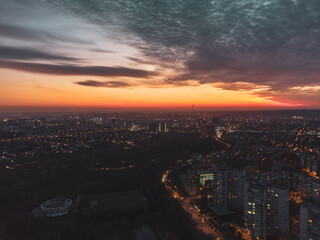 Aerial vivid sunset dark view with epic skyscape. Kharkiv city center, Pavlove pole, botanical...