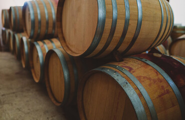 Wine barrels stacked in the cellar.