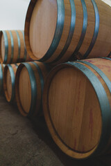 Wine barrels stacked in the cellar.