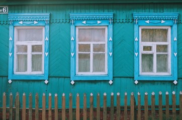 Decorative carved wooden windows. Beautiful  old windows of russian village house. Russian village aesthetic.