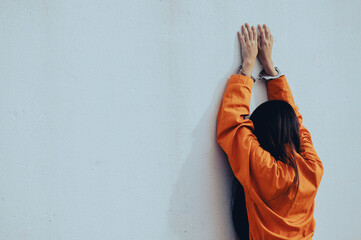 Prisoner in orange robe concept,Portrait of asian woman in Prison uniforms on white background,