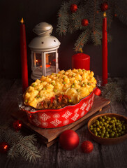 Shepherd's pie, a traditional British dish with minced meat and mashed potatoes on a rustic wooden table. Christmas food - 469969007