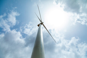 Windmill against blue skies - silhouette