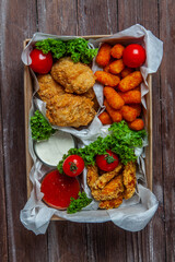 Business lunch in paper container ready for delivery. Top view. Office Lunch boxes with food ready to go. Food takes away. 
