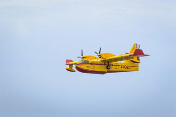 Firefighting seaplane collecting water in the sea.