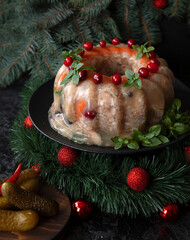 Homemade delicious jelly meat on the festive Christmas table. Perfect cold meat, aspic, galantine with carrots. Russian cuisine - 469973436
