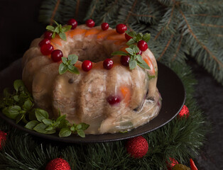 Homemade delicious jelly meat on the festive Christmas table. Perfect cold meat, aspic, galantine with carrots. Russian cuisine - 469973483