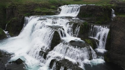 waterfall in bouquet called reykjafoss  from aerial point of view
