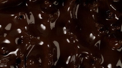 Closeup of splashing dark melted chocolate