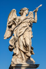 Fototapeta na wymiar ROME, ITALY - SEPTEMBER 1, 2021: Angel with the Lance on the Ponte Sant'Angelo - Angels bridge by Domenico Guidi (1625 – 1701).