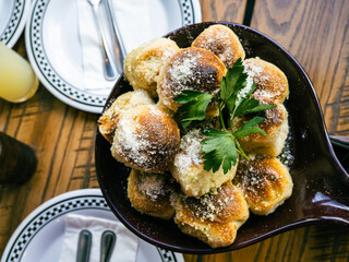 garlic bread bites with parmesan cheese and basil