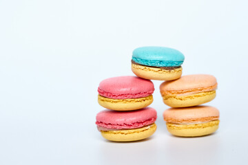 Macaroons lie on a white background