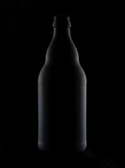 Shaped bottle made of dark glass