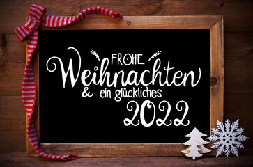 Fototapeta na wymiar Chalkboard, Christmas Decoration, Tree, Glueckliches 2022 Means Happy 2022
