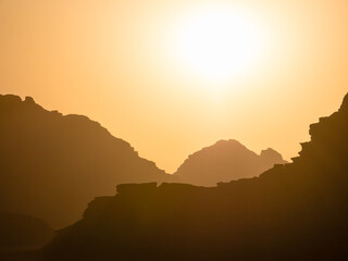 Sunset or sunshine in Wadi Rum desert, Jordan. Beautiful orange desert landscape