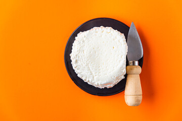 brynza or suluguni pickled cheese provolone meal snack on the table copy space food background rustic. top view keto or paleo diet vegetarian food